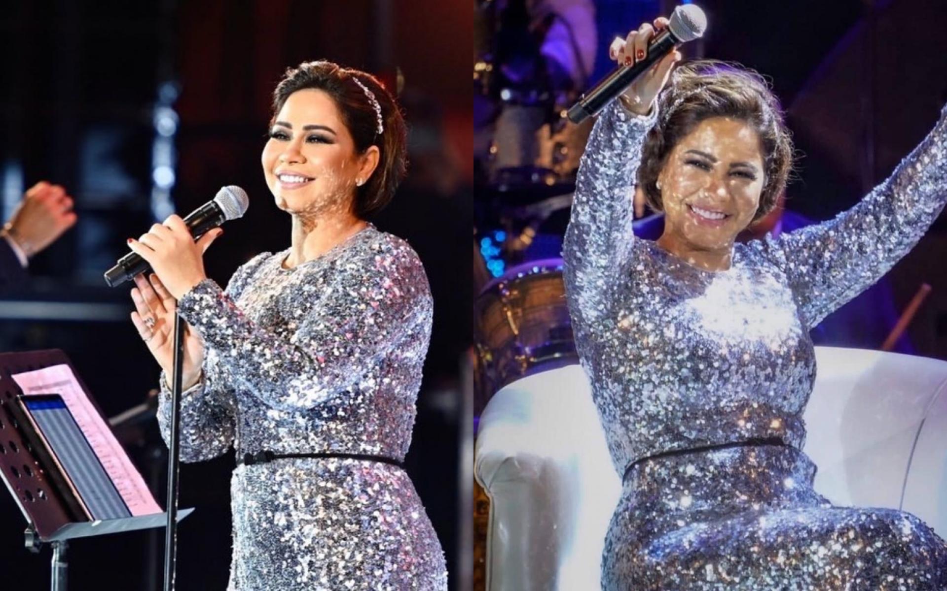 فستان طويل باللون الفضي وحزام بسيط باللون الأسود