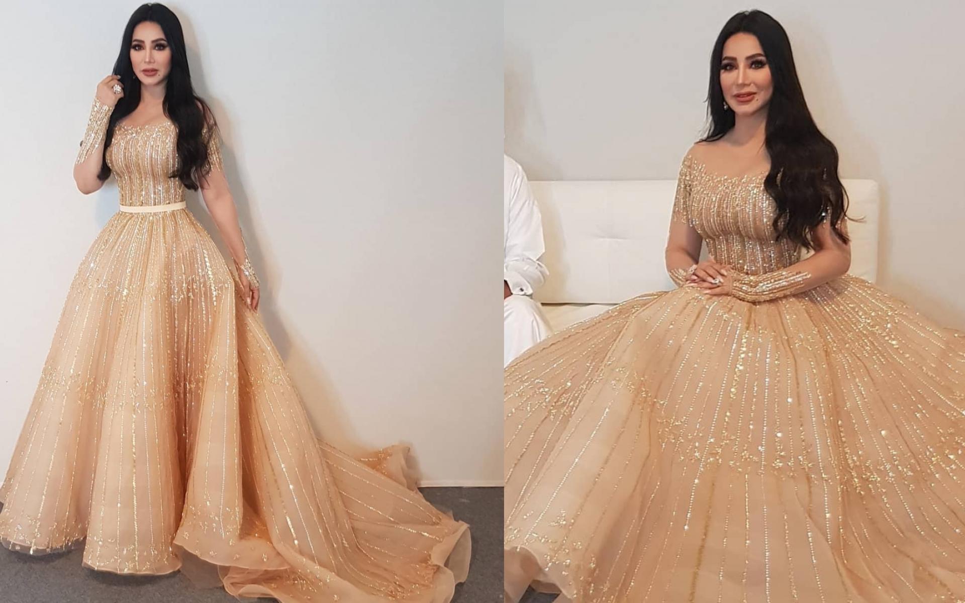 فستان باللون الذهبي وتصميم شكل الـ A الذي يتميز بحجم كبير من أسفل منطقة الخصر وصولاً للأقدام